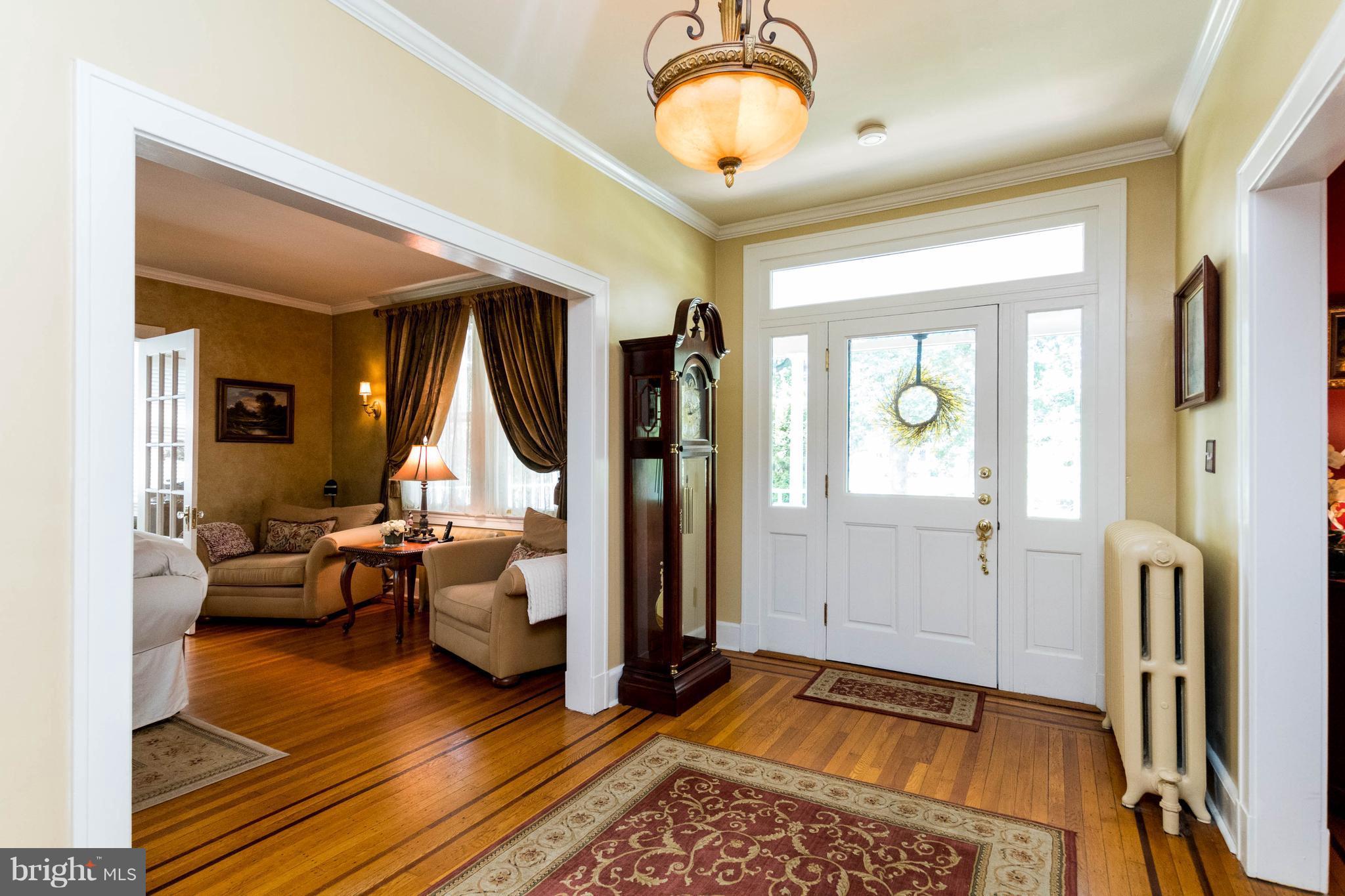 423 South Rolling Road Baltimore, MD 21228 - Photo 6 of 30 a very nice looking room with a large window and chandelier