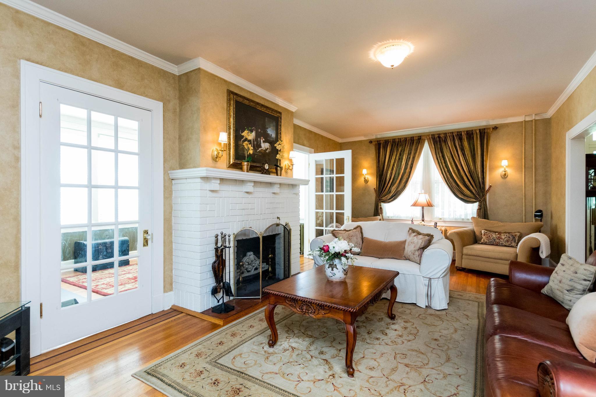 423 South Rolling Road Baltimore, MD 21228 - Photo 7 of 30 a living room with furniture fireplace and window