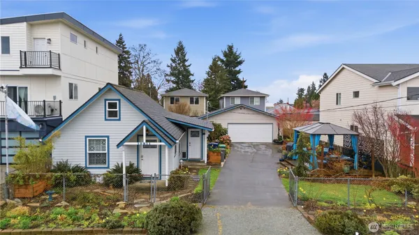 a front view of a house with garden
