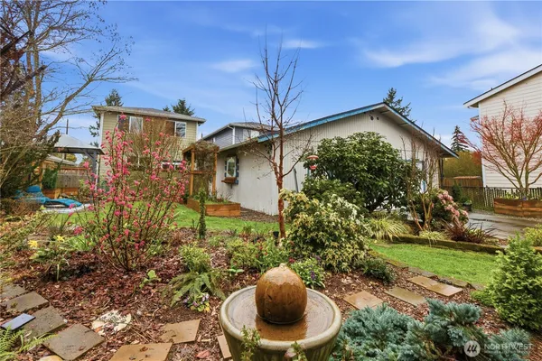 a view of a tree in front of a house