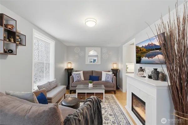 a living room with furniture and a fireplace