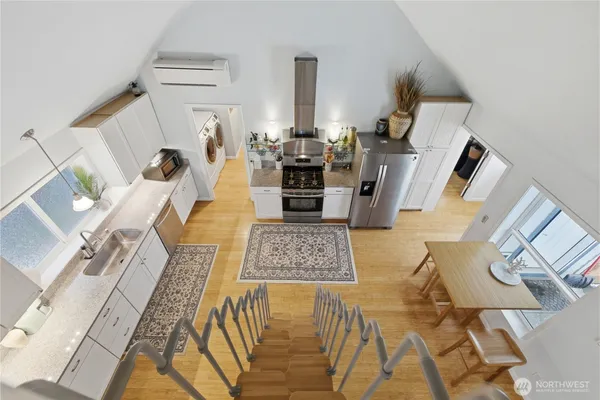 a view of living room with furniture and wooden floor