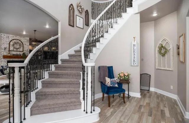 a view of entryway and hall with wooden floor