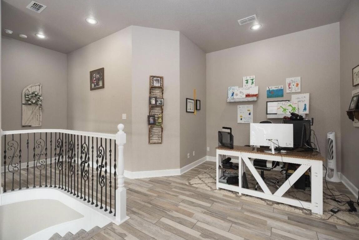 8 West Lakeshore Drive Ransom Canyon, TX 79366 - Photo 26 of 44 a workspace with furniture and wooden floor