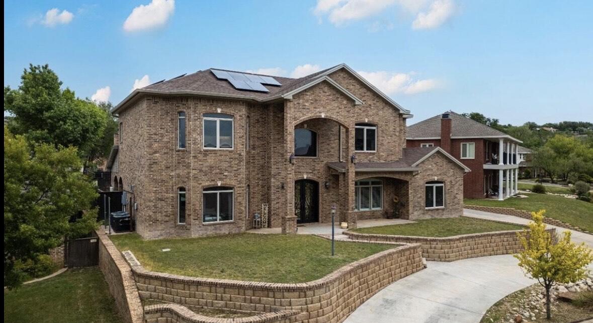 8 West Lakeshore Drive Ransom Canyon, TX 79366 - Photo 3 of 44 a front view of a house with a yard