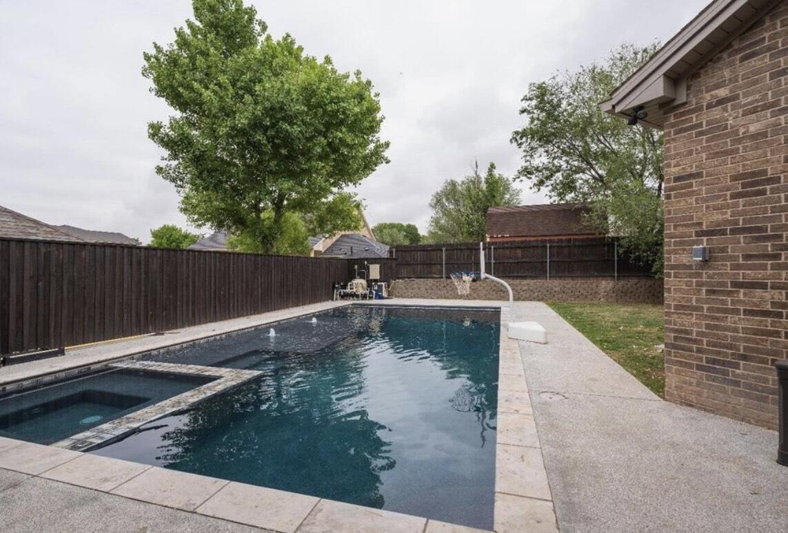 8 West Lakeshore Drive Ransom Canyon, TX 79366 - Photo 43 of 44 a view of a swimming pool with a patio