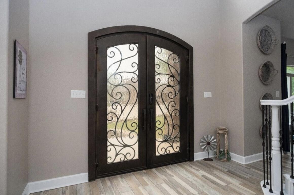 8 West Lakeshore Drive Ransom Canyon, TX 79366 - Photo 5 of 44 a view of front door with wooden floor