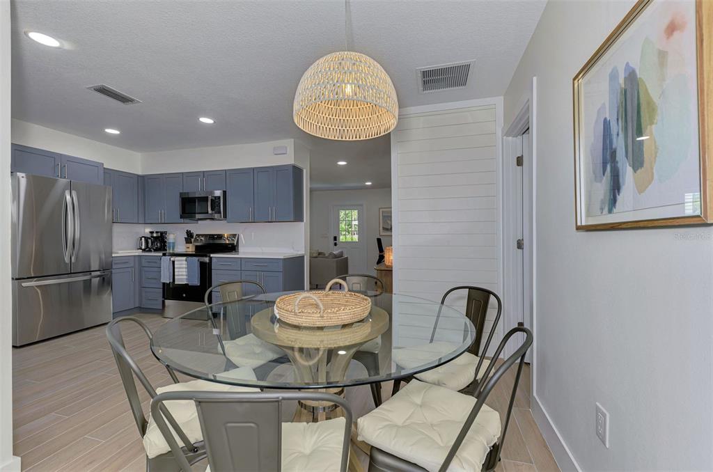 1100 Point Of Rocks Road Sarasota, FL 34242 - Photo 14 of 53 a kitchen with a dining table and chairs