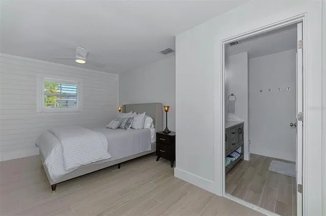 a bedroom with a bed and a table