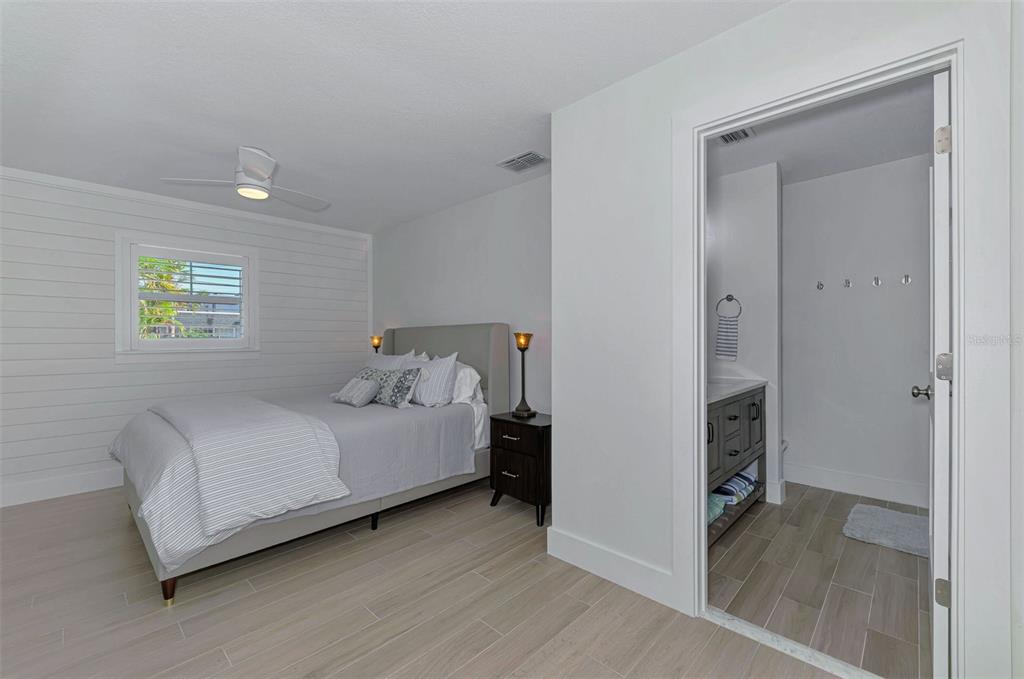 1100 Point Of Rocks Road Sarasota, FL 34242 - Photo 16 of 53 a bedroom with a bed and a table