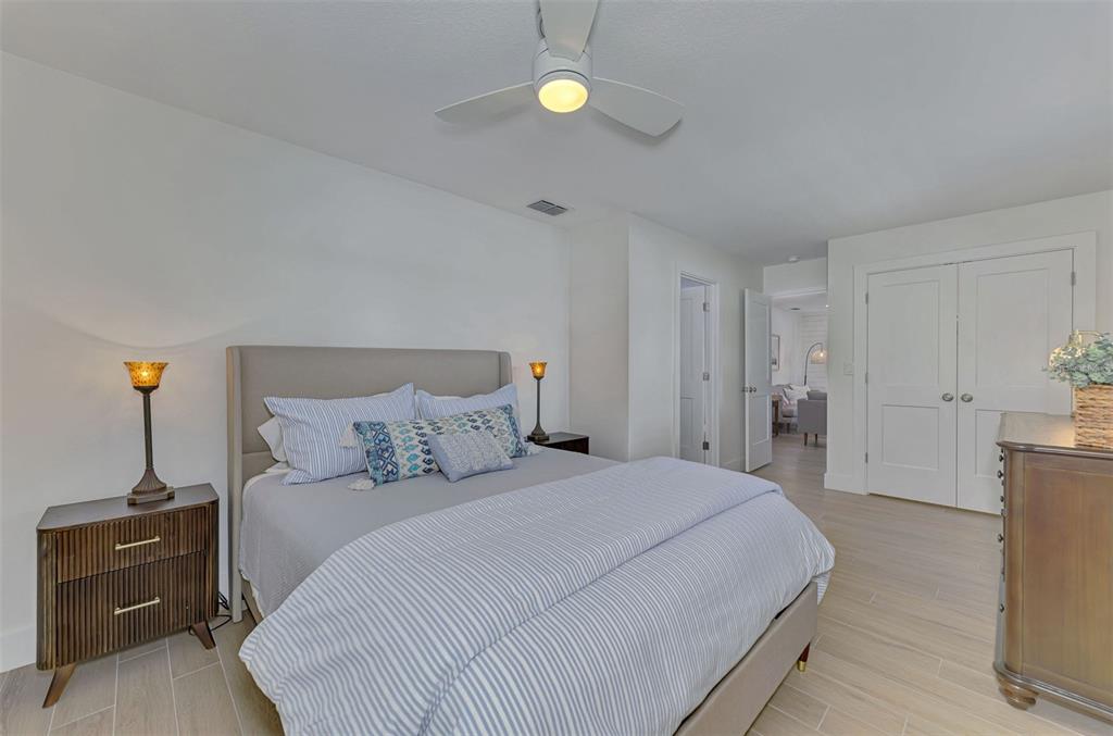 1100 Point Of Rocks Road Sarasota, FL 34242 - Photo 17 of 53 a bedroom with a bed and a lamp