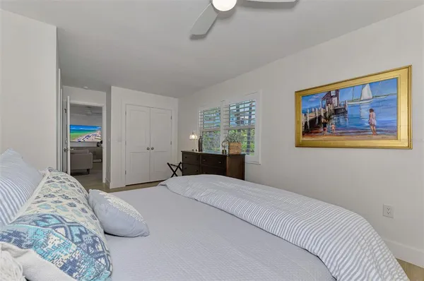 a bedroom with a large bed and a couch