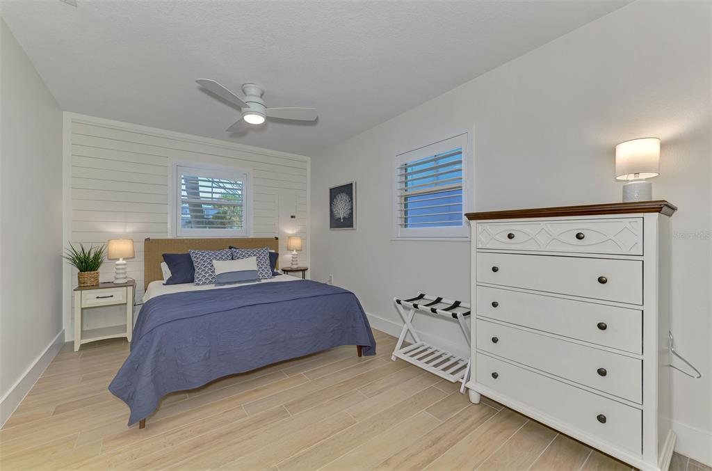 1100 Point Of Rocks Road Sarasota, FL 34242 - Photo 21 of 53 a bedroom with a bed and a dresser