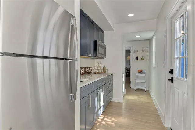 a view of a kitchen with sink and dining table