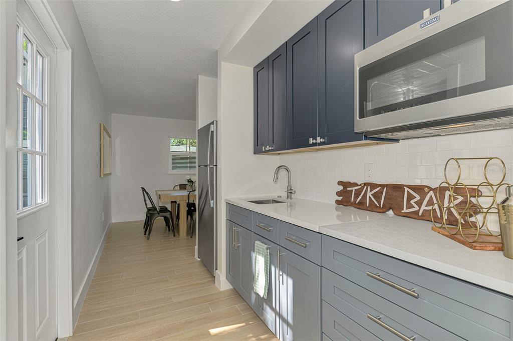 1100 Point Of Rocks Road Sarasota, FL 34242 - Photo 27 of 53 a view of a kitchen with sink and dining table