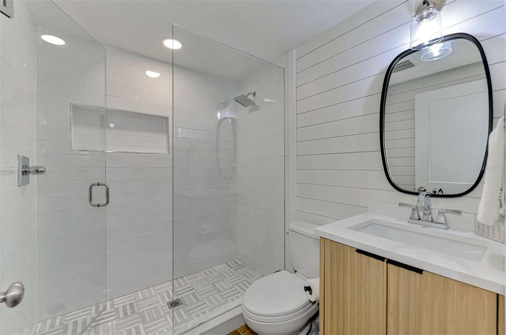 1100 Point Of Rocks Road Sarasota, FL 34242 - Photo 34 of 53 a bathroom with a sink a toilet and shower