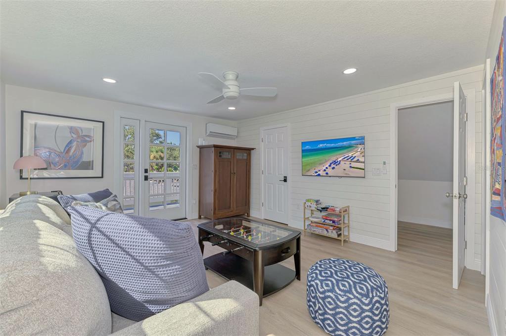 1100 Point Of Rocks Road Sarasota, FL 34242 - Photo 36 of 53 a living room with furniture and a flat screen tv