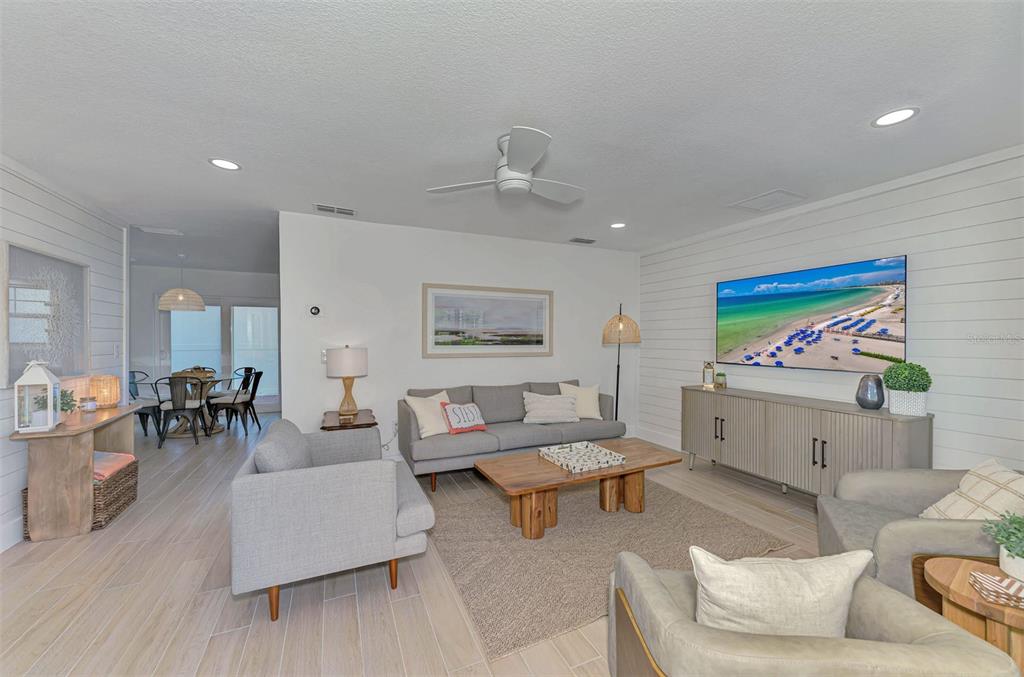 1100 Point Of Rocks Road Sarasota, FL 34242 - Photo 5 of 53 a living room with furniture and a flat screen tv