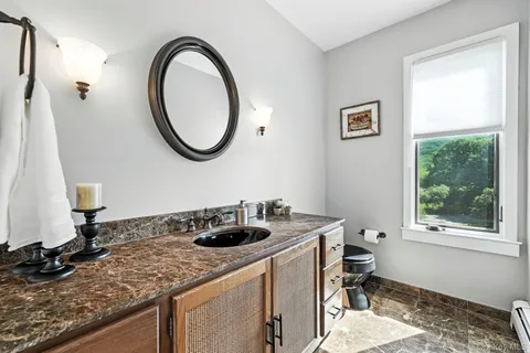 a kitchen with a sink a stove and a window