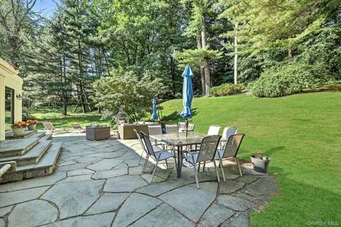 a view of a patio with a table chairs and a table