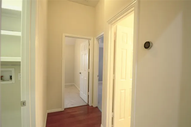 a view of a patio with chairs and table on the wooden floor