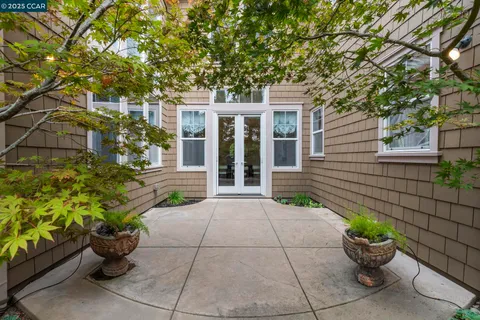 a dining room with furniture and a window