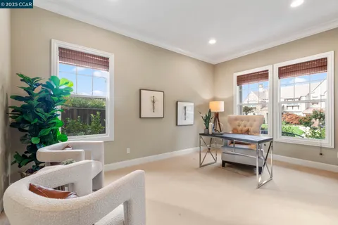 a view of a livingroom with furniture window and wooden floor