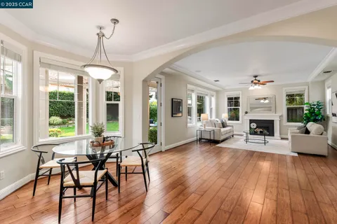 a kitchen with sink a counter top space and living room