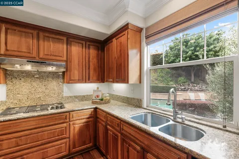 a view of staircase with furniture and floor to ceiling window