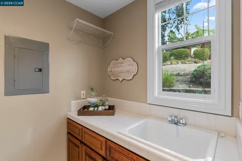 a spacious bedroom with a large bed and a large window