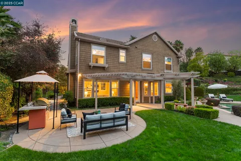 a view of a backyard with sitting area