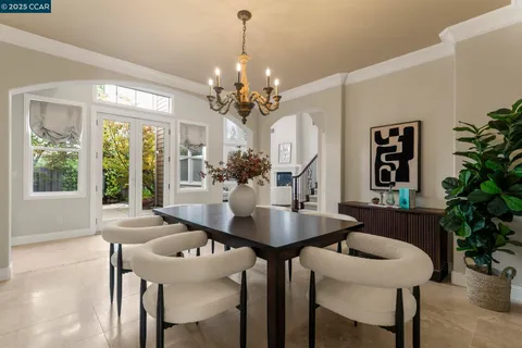 a view of a house with a chairs and a potted plant