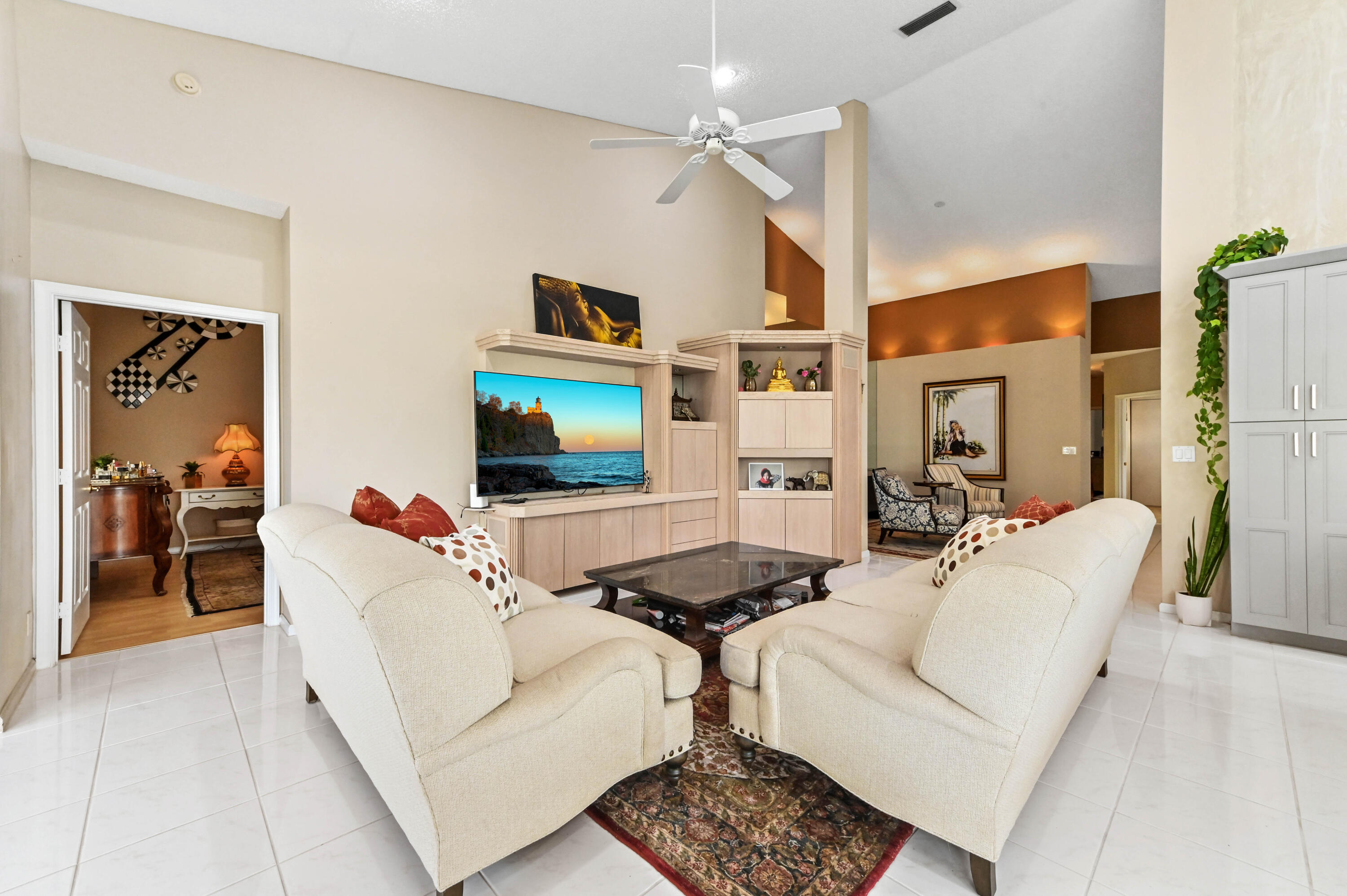 8319 Horseshoe Bay Road Boynton Beach, FL 33472 - Photo 12 of 69 a living room with furniture and a flat screen tv