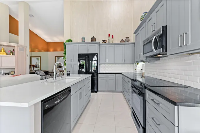 a living room with furniture and a mirror