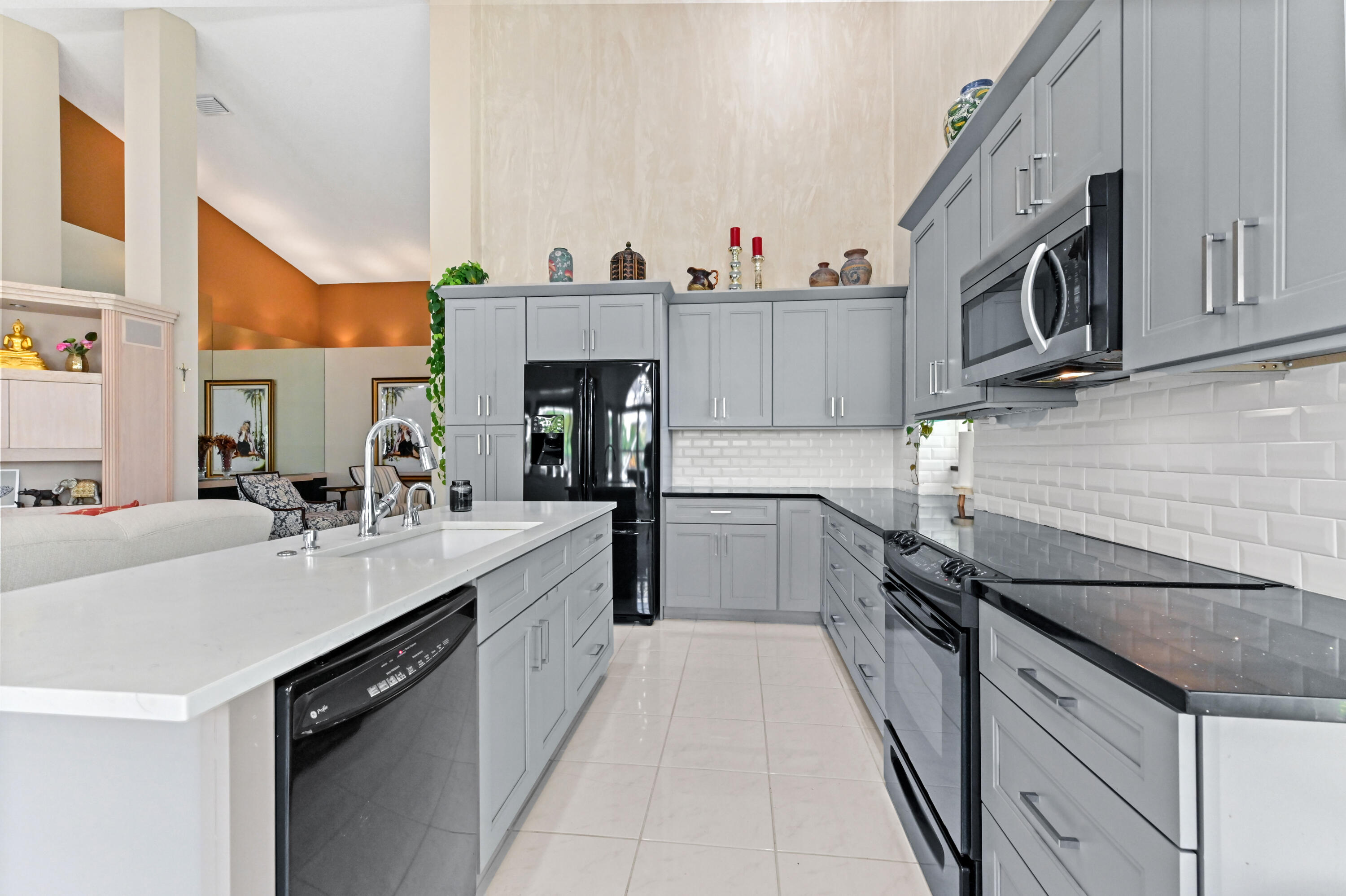 8319 Horseshoe Bay Road Boynton Beach, FL 33472 - Photo 14 of 69 a kitchen with stainless steel appliances granite countertop a sink and cabinets