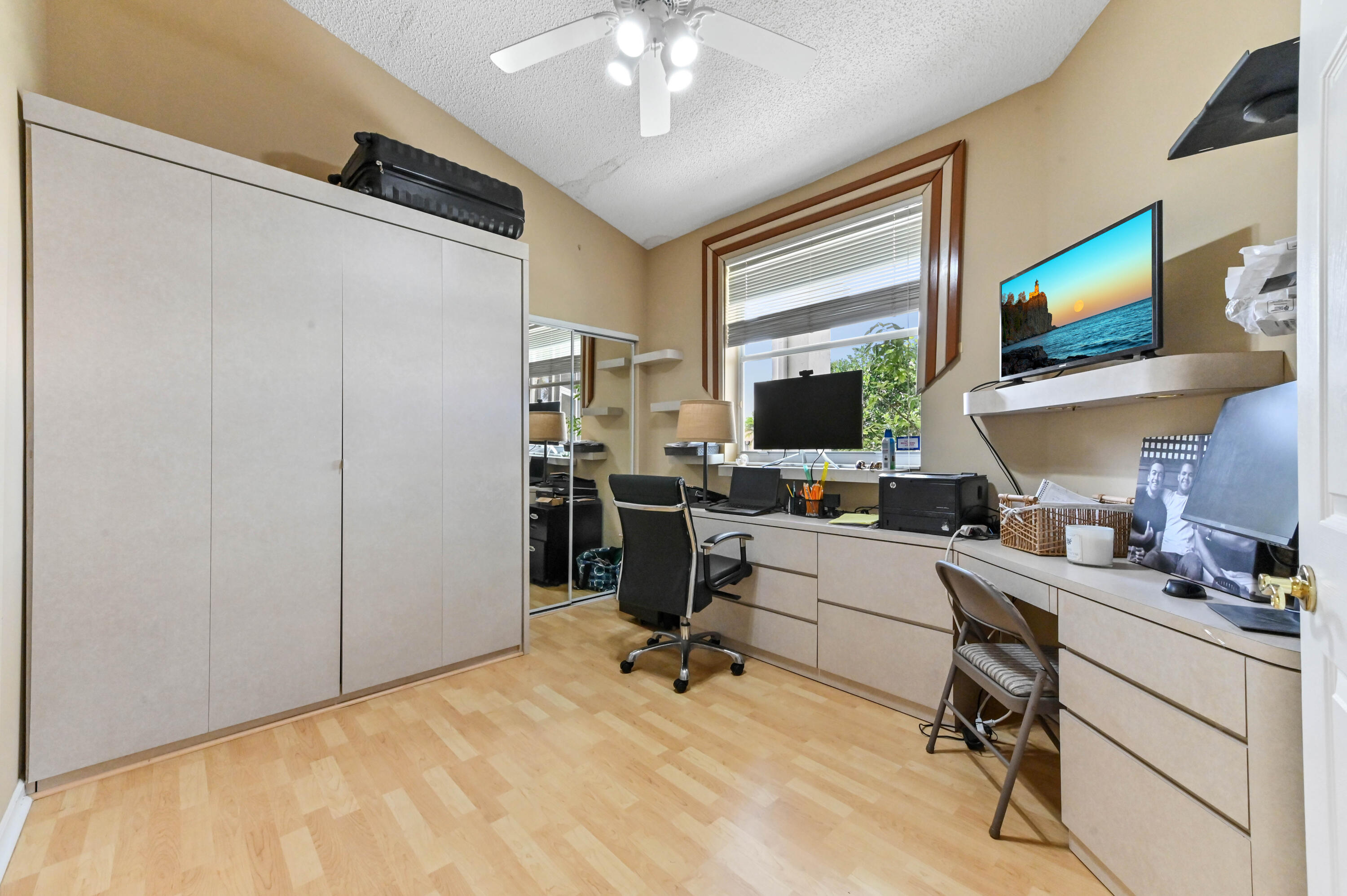 8319 Horseshoe Bay Road Boynton Beach, FL 33472 - Photo 20 of 69 a view of a workspace with furniture and a window
