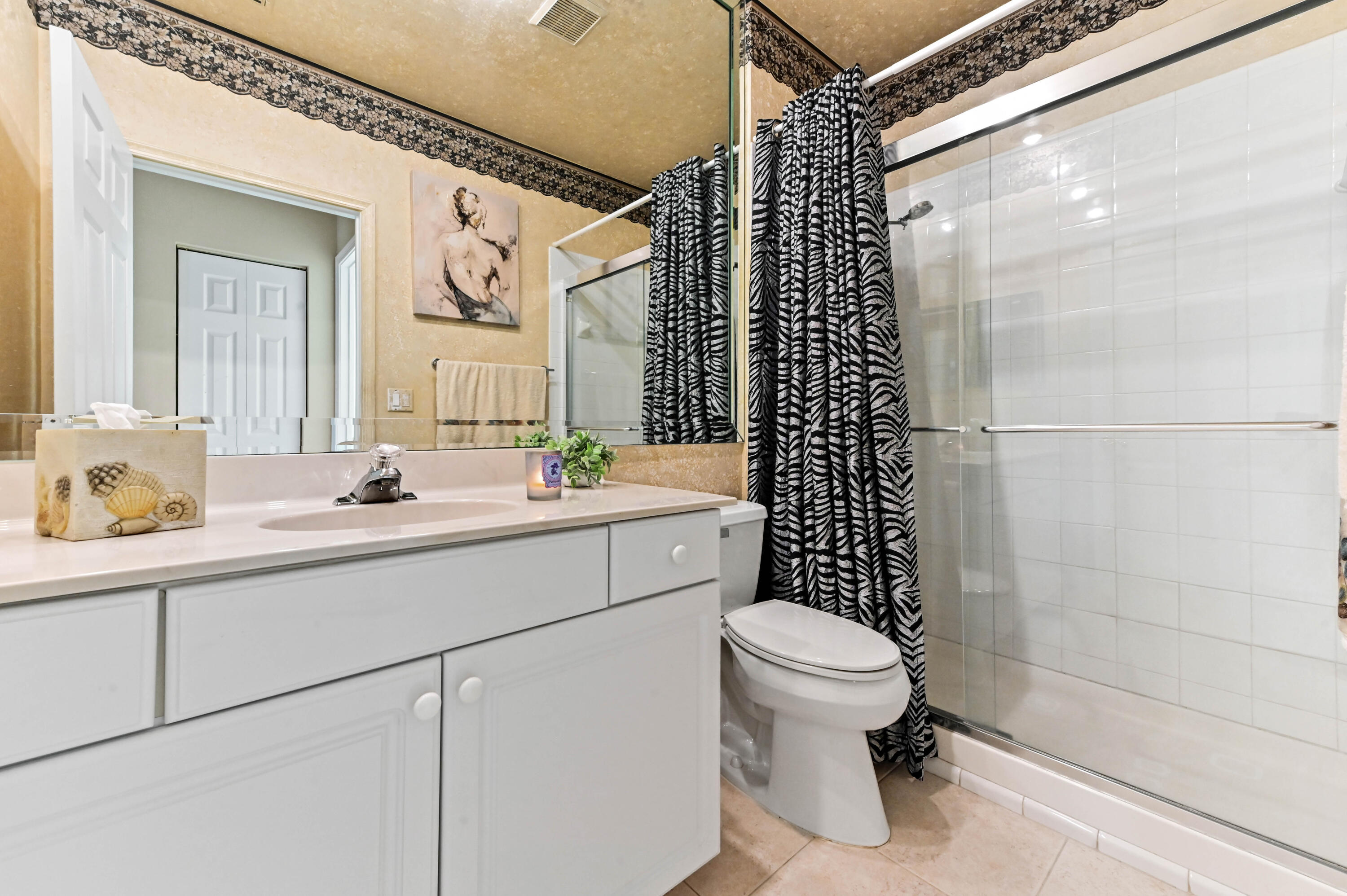 8319 Horseshoe Bay Road Boynton Beach, FL 33472 - Photo 22 of 69 a bathroom with a sink a toilet and shower