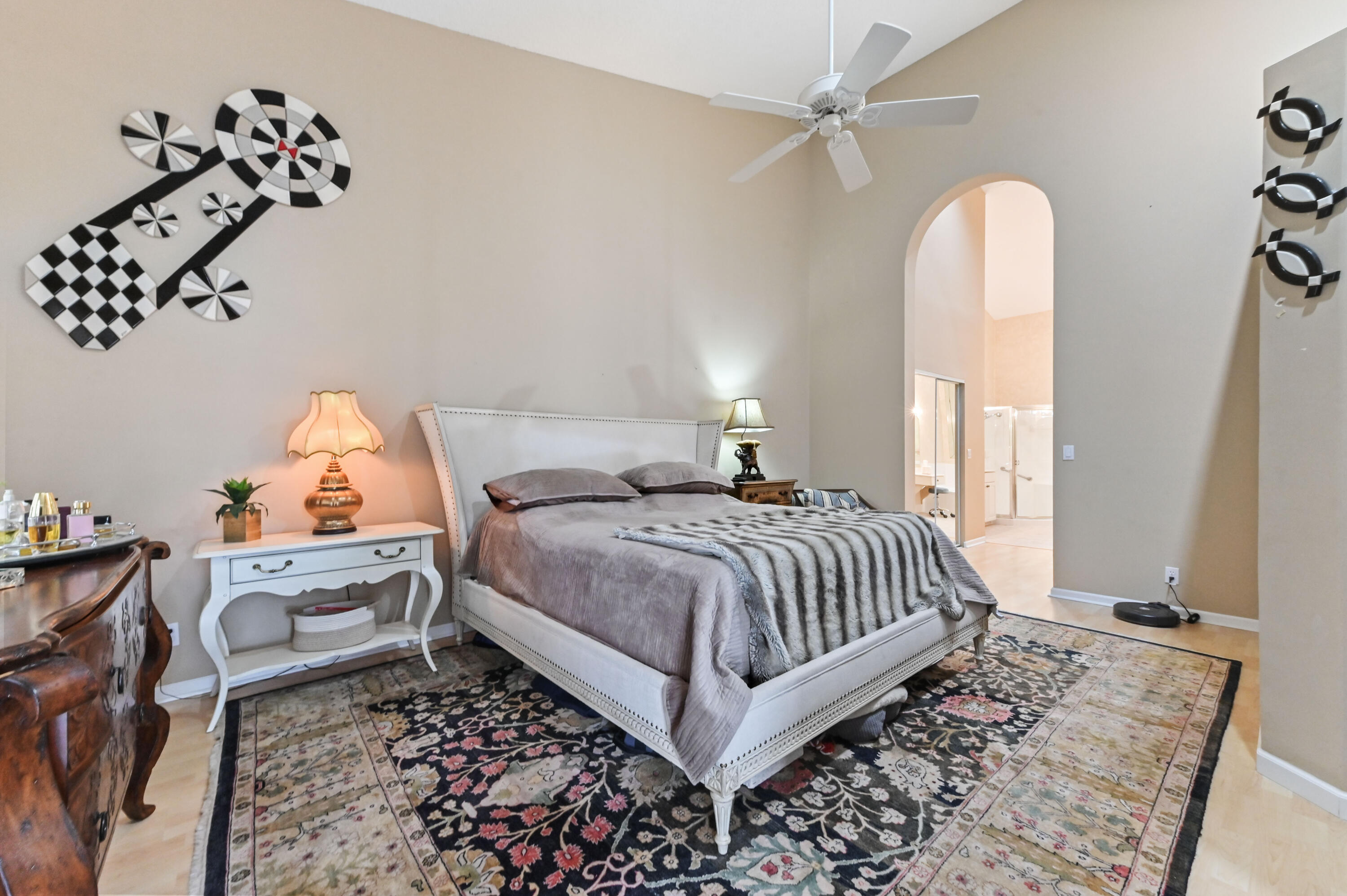 8319 Horseshoe Bay Road Boynton Beach, FL 33472 - Photo 26 of 69 a bedroom with a bed and a chandelier