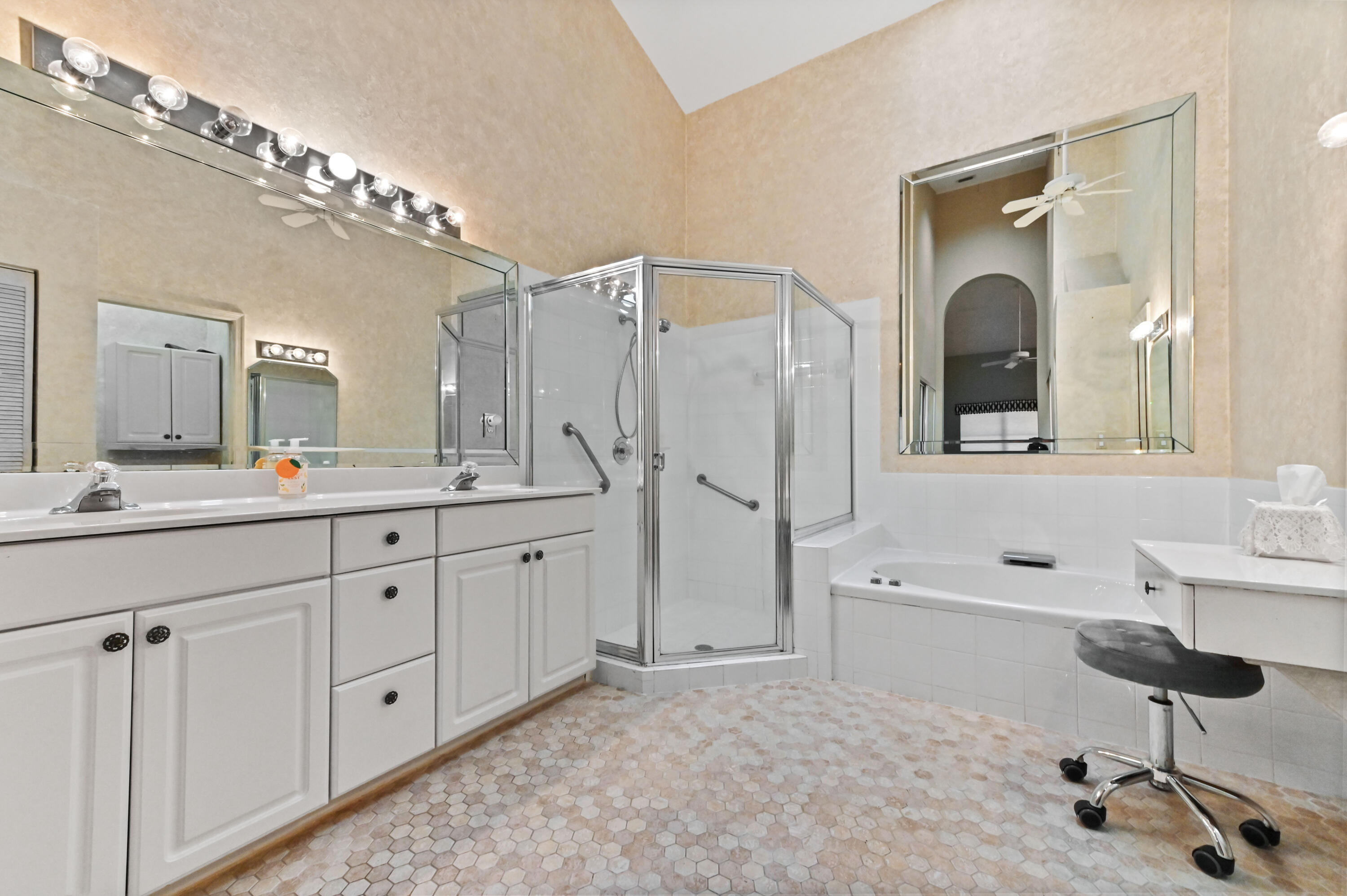 8319 Horseshoe Bay Road Boynton Beach, FL 33472 - Photo 30 of 69 a spacious bathroom with a double vanity sink mirror and bathtub