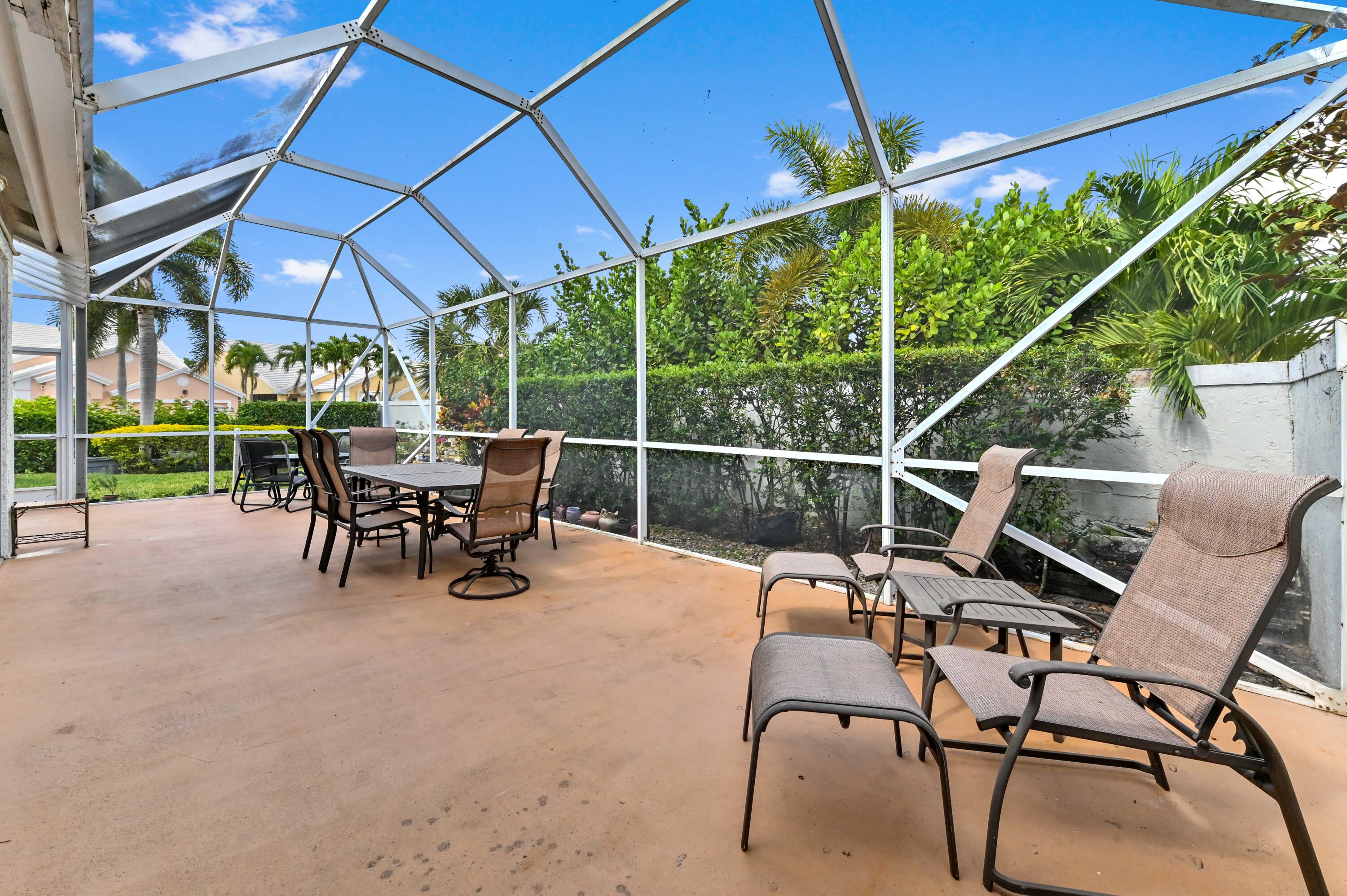 8319 Horseshoe Bay Road Boynton Beach, FL 33472 - Photo 34 of 69 a view of chair and tables in the patio