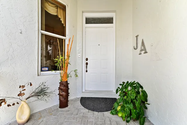 a balcony with chairs and a table