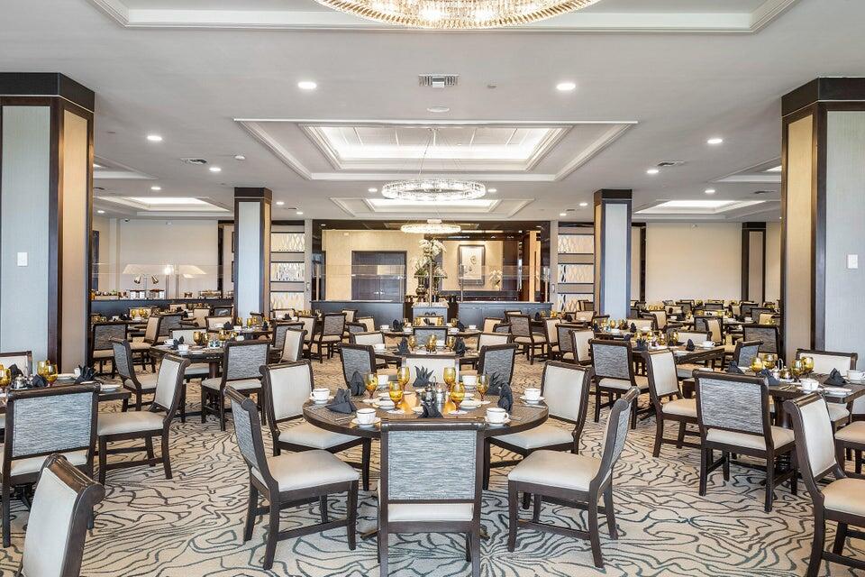 8319 Horseshoe Bay Road Boynton Beach, FL 33472 - Photo 52 of 69 a large room with lots of chairs and mirrors