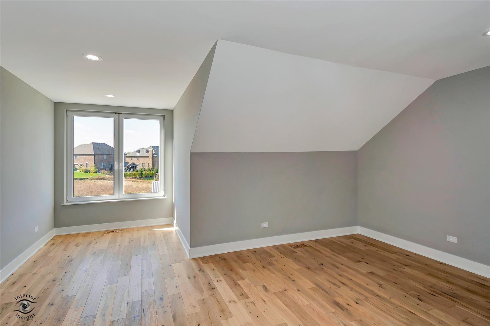 16441 Kayla Drive Lemont, IL 60439 - Photo 20 of 29 an empty room with wooden floor and windows