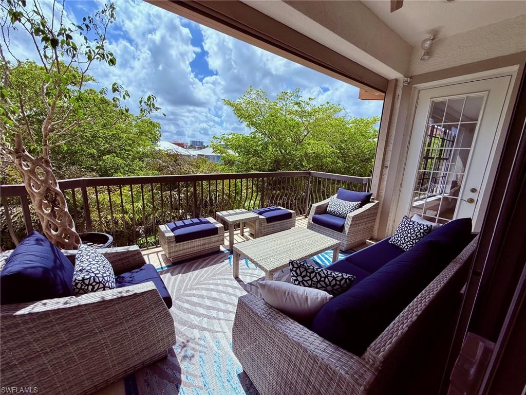 705 10th Street South, Unit 301 Naples, FL 34102 - Photo 11 of 35 a outdoor living room with furniture