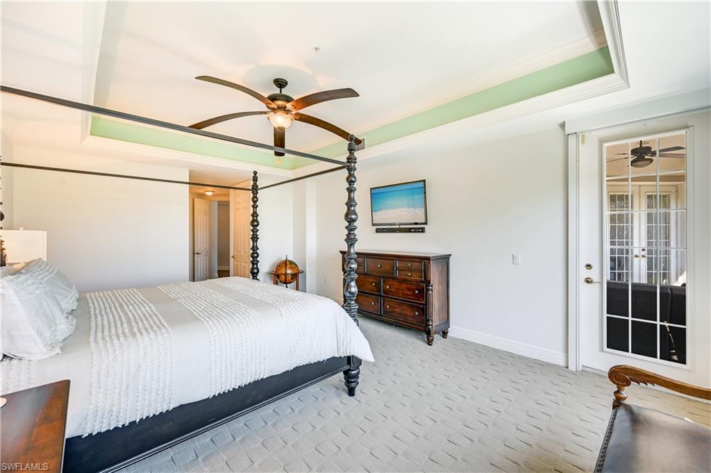 705 10th Street South, Unit 301 Naples, FL 34102 - Photo 16 of 35 a bedroom with a bed dresser and a window