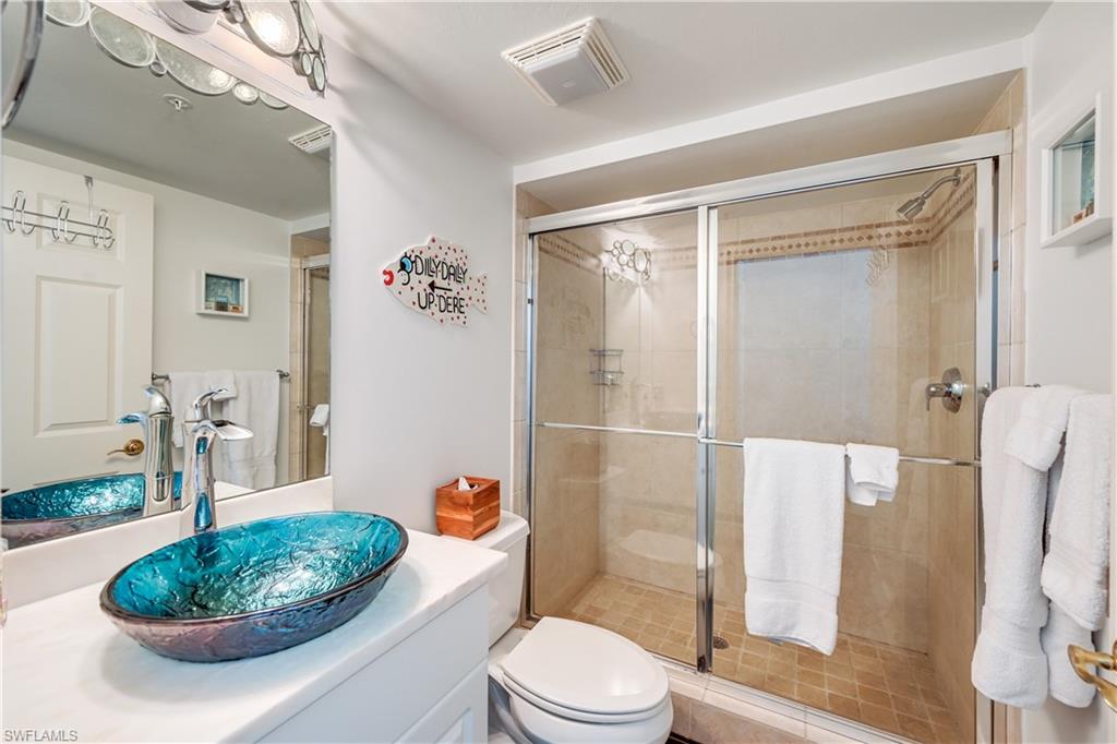 705 10th Street South, Unit 301 Naples, FL 34102 - Photo 27 of 35 a bathroom with a toilet and a shower