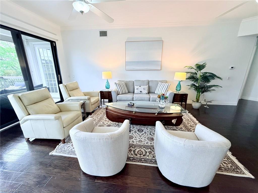 705 10th Street South, Unit 301 Naples, FL 34102 - Photo 3 of 35 a living room with couches and a potted plant