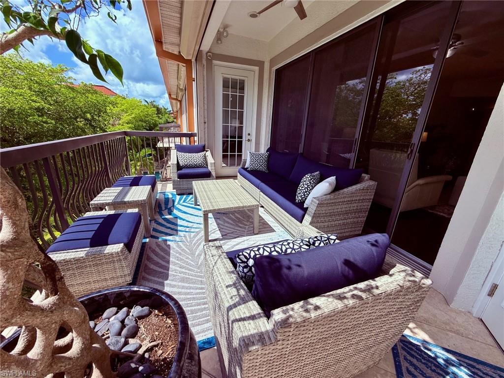 705 10th Street South, Unit 301 Naples, FL 34102 - Photo 31 of 35 a view of a balcony with furniture