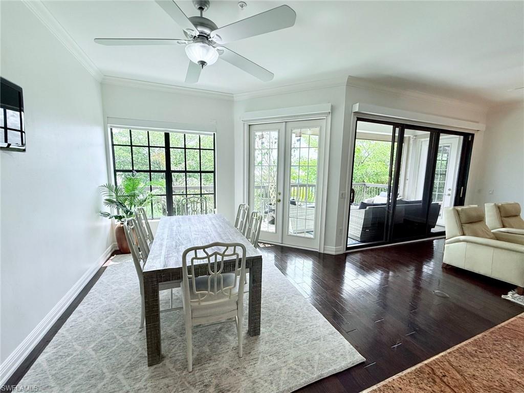 705 10th Street South, Unit 301 Naples, FL 34102 - Photo 9 of 35 a view of a dining room with furniture window and wooden floor