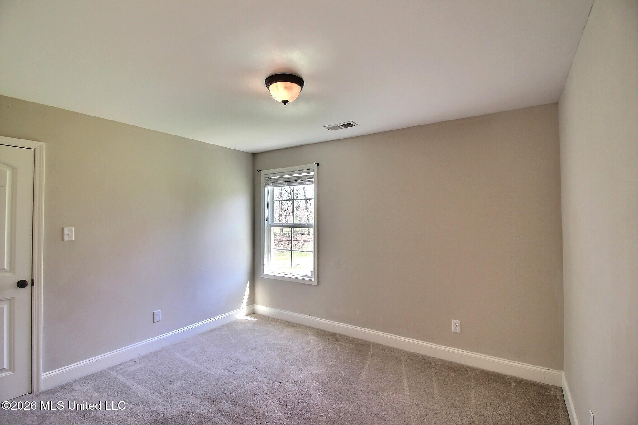 4722 Alexander Road Olive Branch, MS 38654 - Photo 15 of 18 Back Left Bedroom Up & Walk-In Closet